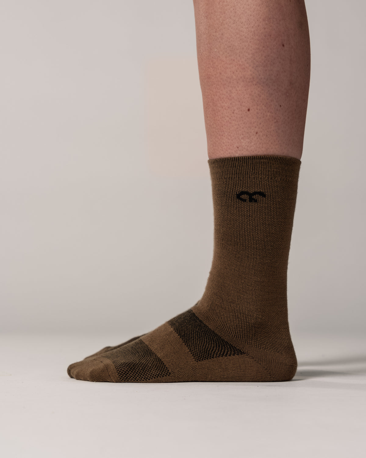 Hochgeschnittene Pro Socken aus Merinowolle braun